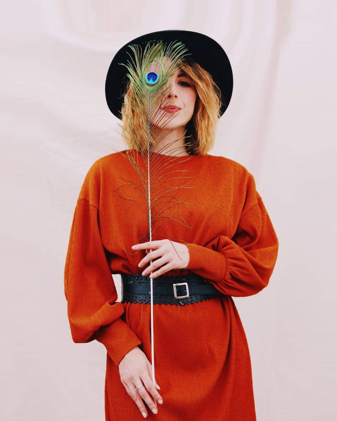 Marzia Gamba holding a peacock feather